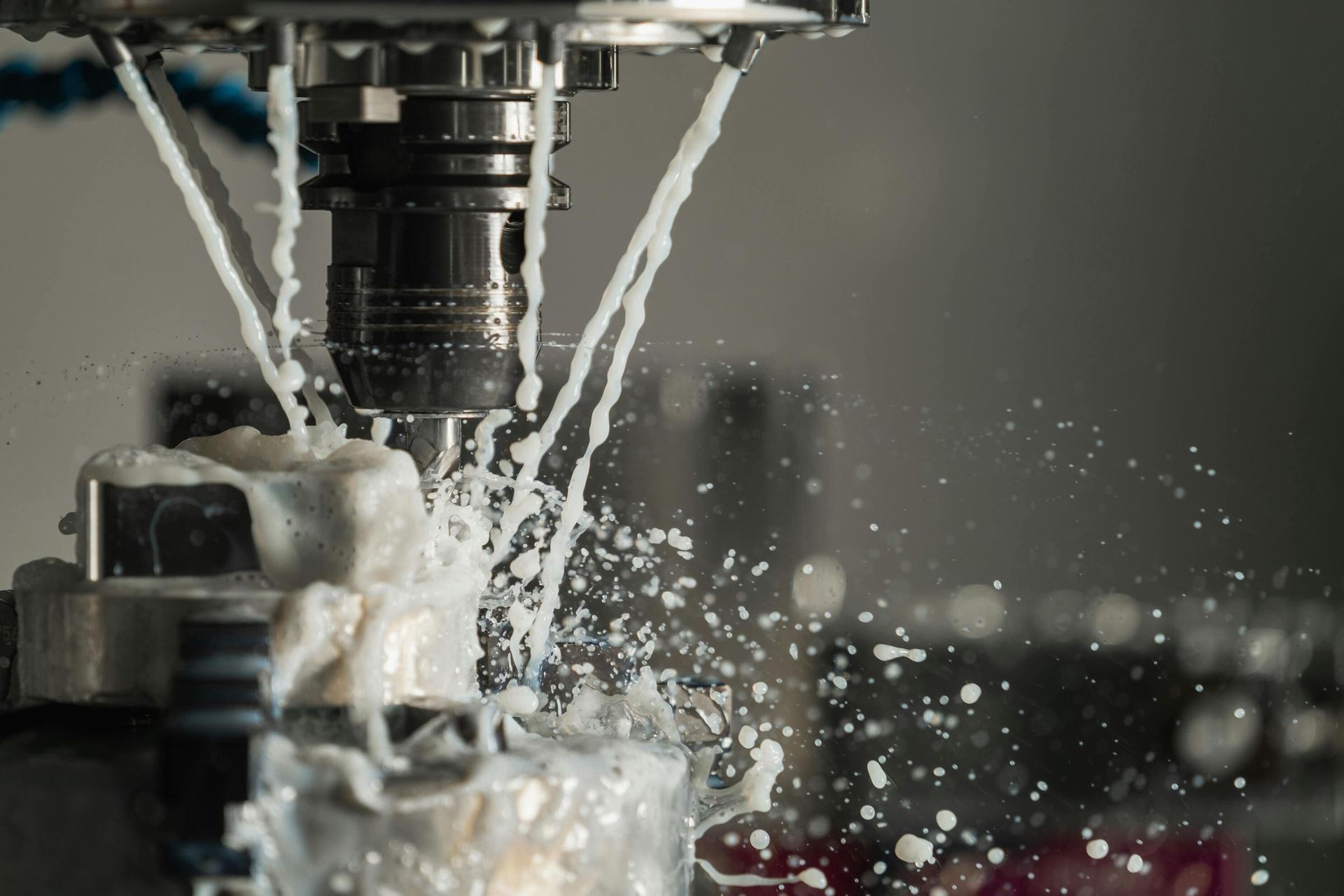 High-pressure coolant flooding a machining operation