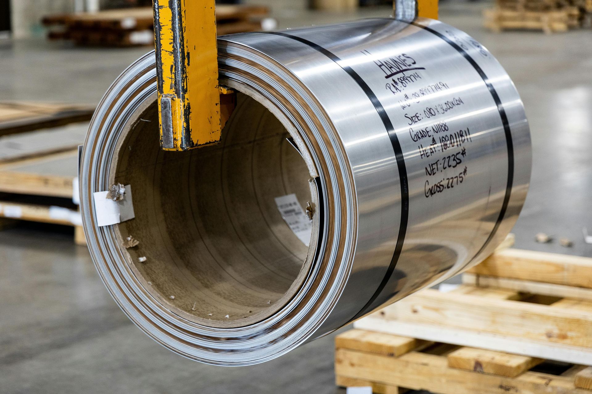 Stainless steel coil with handwritten heat number and grade markings