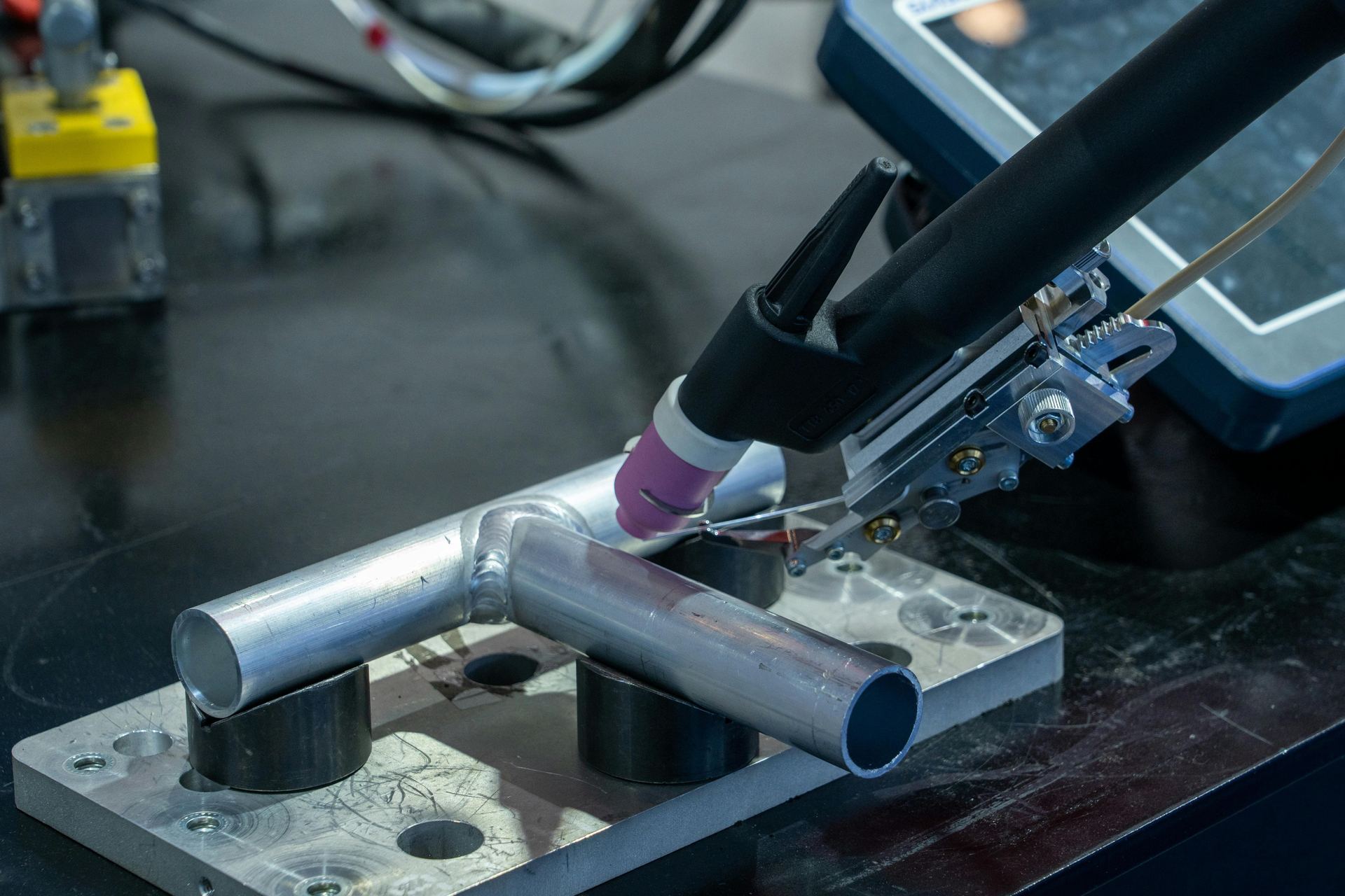 TIG welding of an aluminium tube assembly held in a fixture